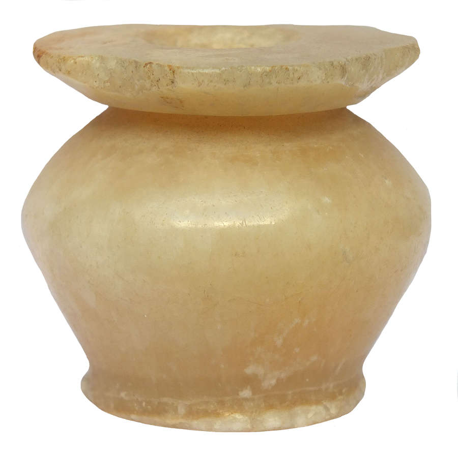 An Egyptian alabaster cosmetic pot