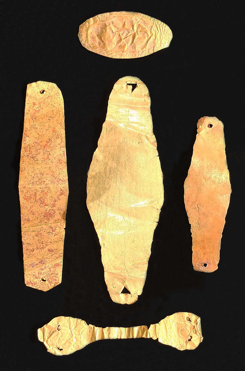 A group of five Hellenistic sheet gold appliqués and adornments