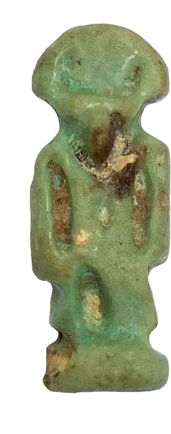A small Egyptian faience amulet of a deity, after 600 B.C.
