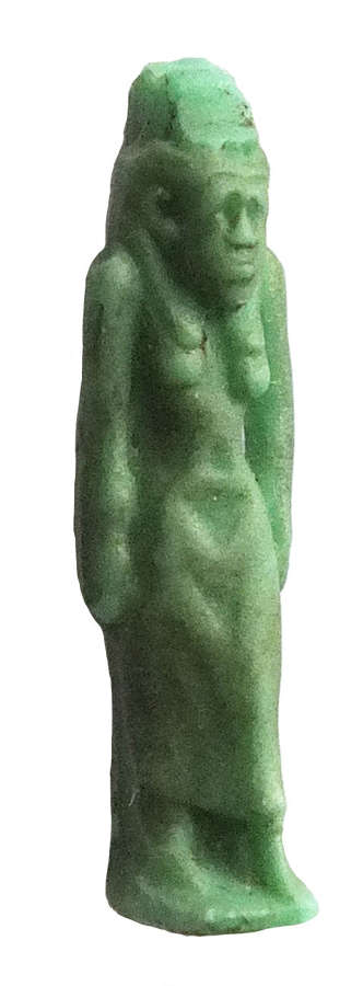 An Egyptian green glass amulet of a standing goddess, c. 600-300 B.C.