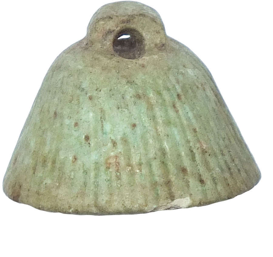 An Egyptian faience flower calyx amulet, c. 1st Millennium B.C.