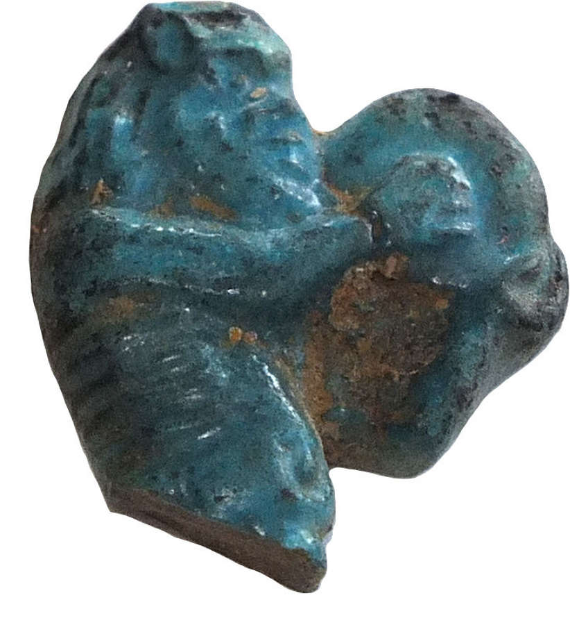 An Egyptian fragmentary faience Bes amulet, c. 1353-1323 B.C.