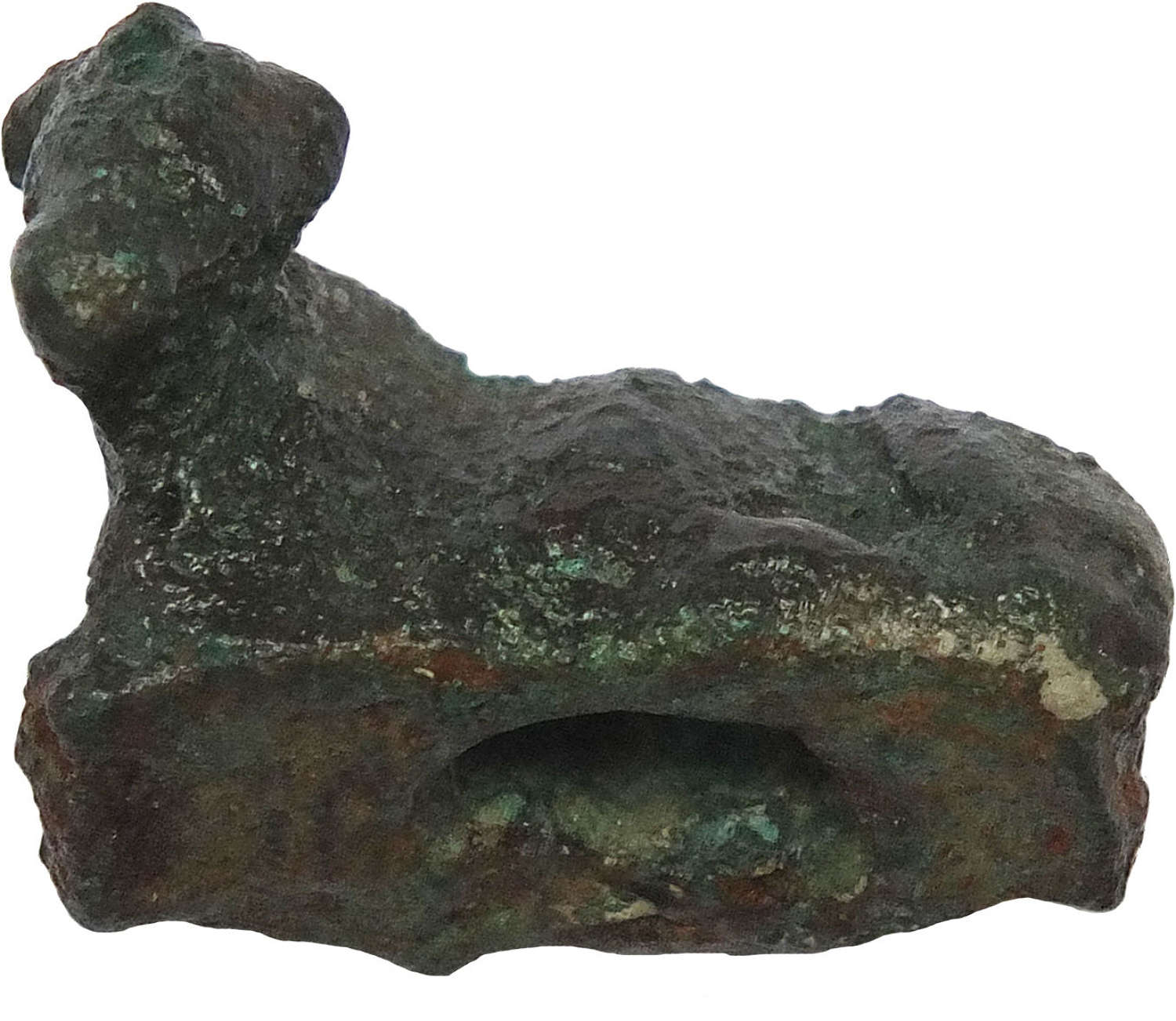 An Egyptian amuletic bronze of a recumbent bull or cow, c. 600 B.C.