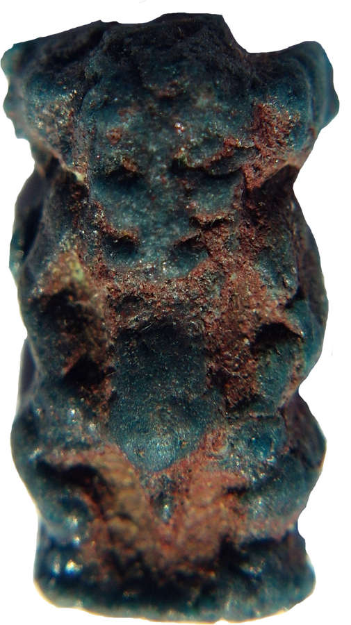 An Egyptian blue composition amulet of Bes, 1st Millennium B.C.