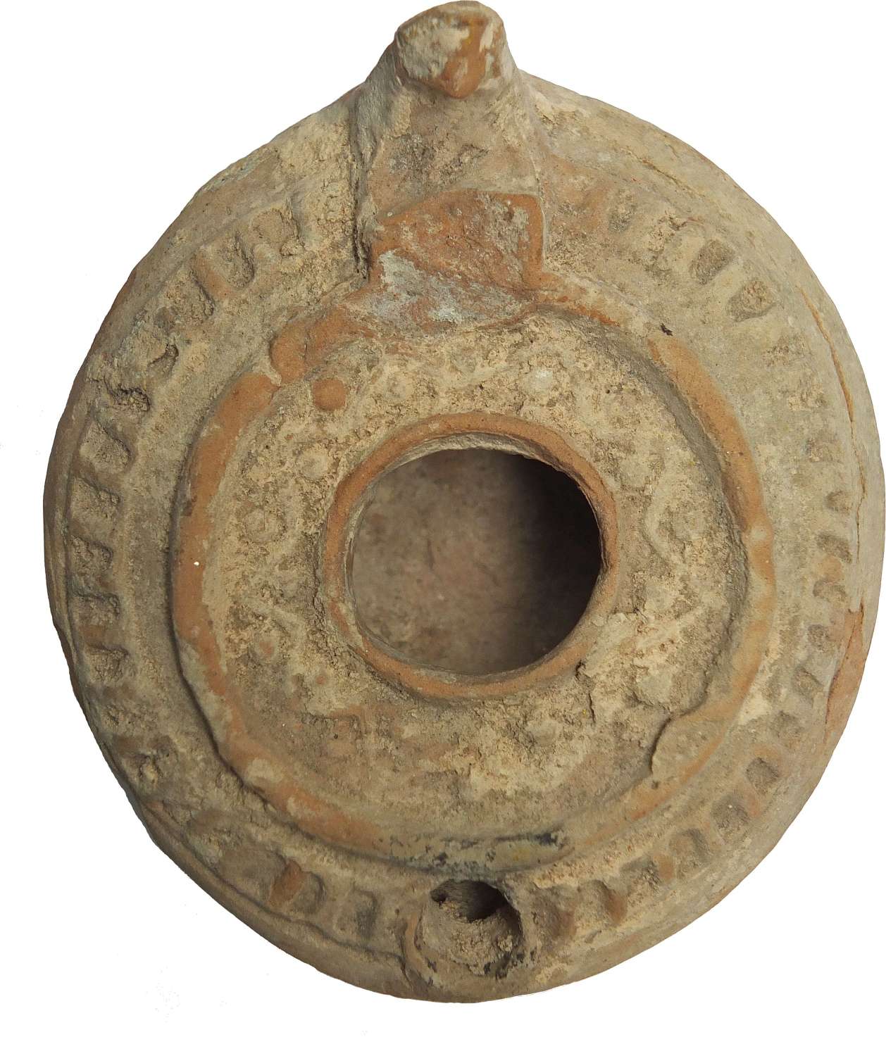 A fawn circular terracotta oil lamp, c. 600-800 A.D.