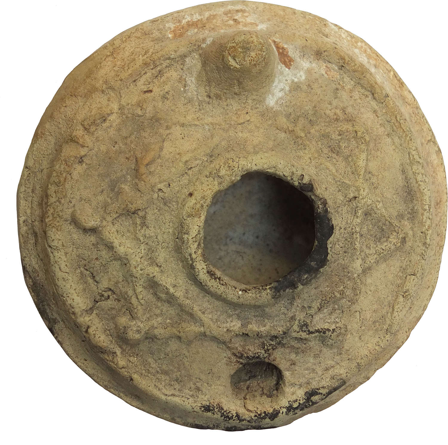 A circular Byzantine pottery oil lamp, c. 600-800 A.D.