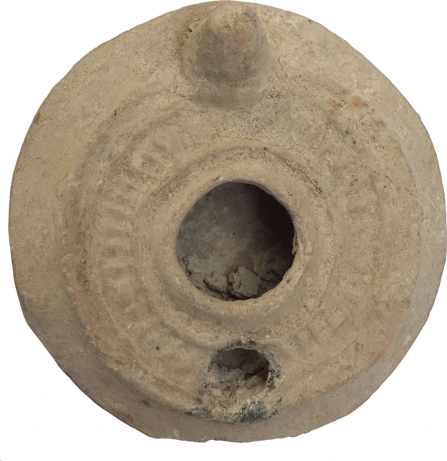 A circular Byzantine/early Islamic pottery oil lamp, c. 600-800 A.D.