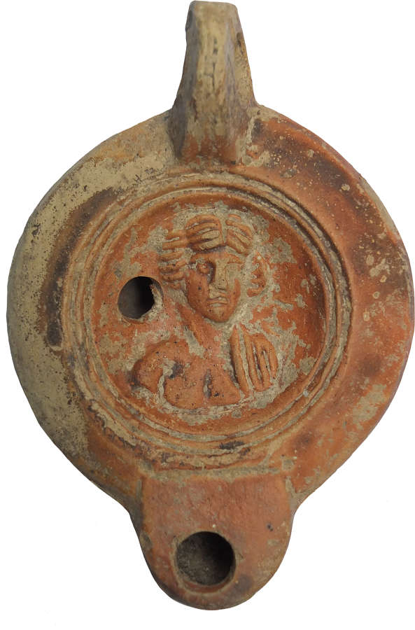 A Roman red-slipped terracotta oil lamp, c. 120–200 A.D.