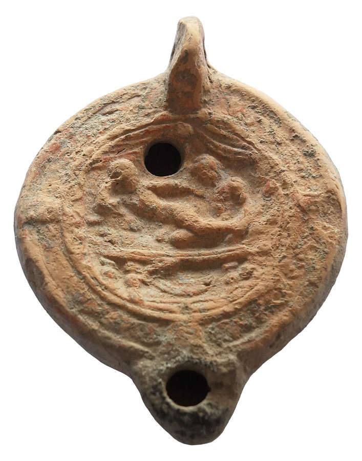 A Roman erotic terracotta oil lamp, c. 2nd - 3rd Century A.D.