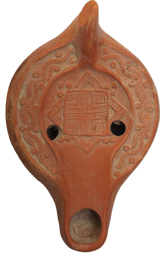 A Roman North African red ware lamp, Tunisia, c. 5th Century A.D.