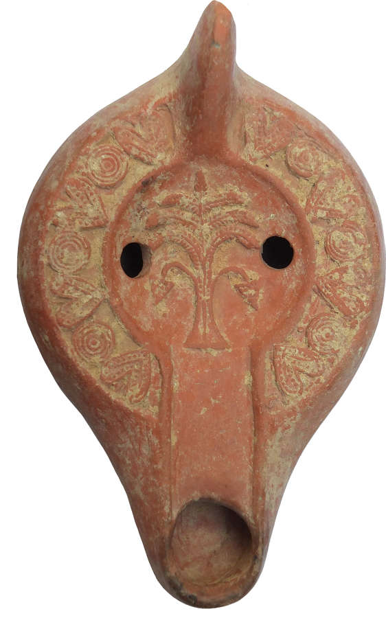 A Roman North African red ware lamp, Tunisia, c. 5th Century A.D.