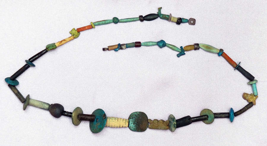 A long restrung necklace of Egyptian faience beads of varied type