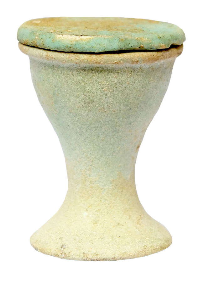 An Egyptian pale blue faience offering cup, c. 1550-30 B.C.