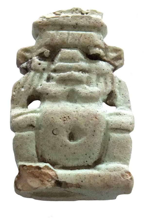 A sizeable Egyptian pale blue faience amulet of Bes