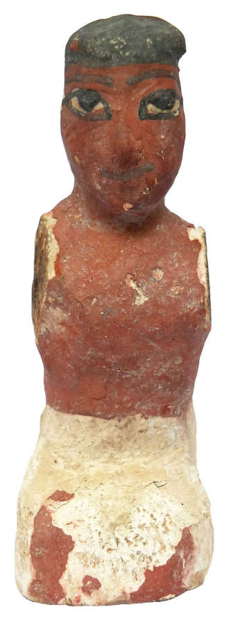 An Egyptian wooden figure, Middle Kingdom, c. 2000-1800 B.C.