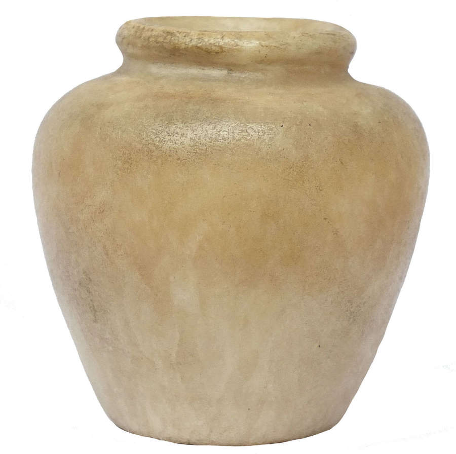 An Egyptian honey-coloured alabaster kohl jar, c. 1st Millennium B.C.