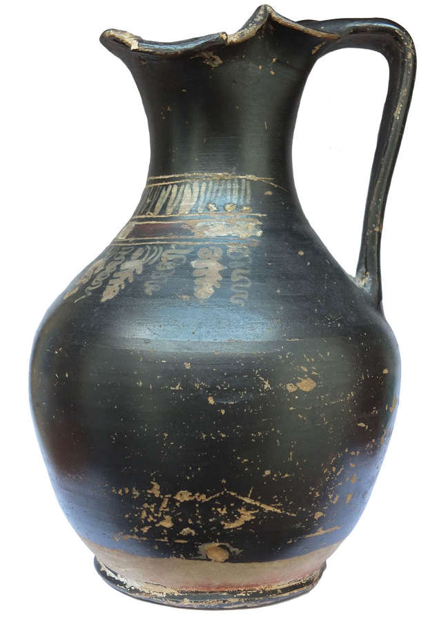 A Greek Gnathia Ware black glazed oinochoe, c. 4th Century B.C.