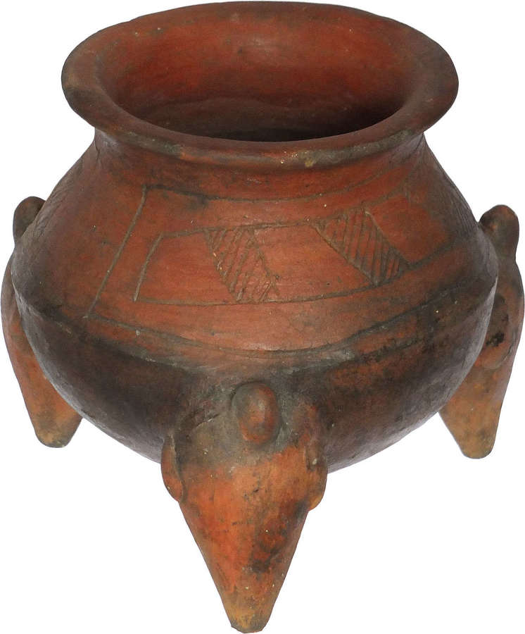 A Costa Rican orange terracotta tripod vessel, c. 800-1500 A.D.