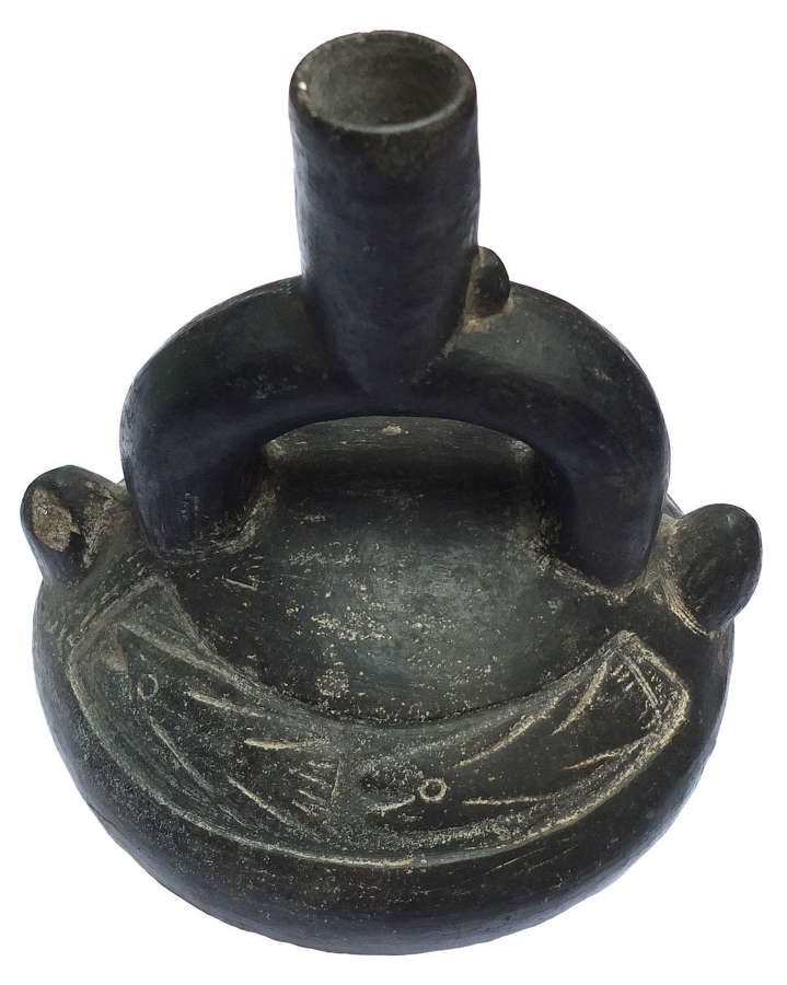 A Chimu blackware stirrup vessel, Peru, c. 900-1400 A.D.