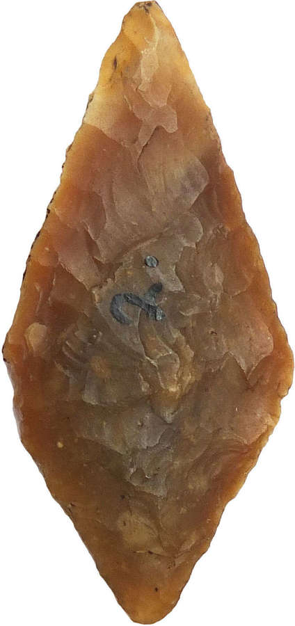 A fine Neolithic lozenge-shaped flint arrowhead, c. 3000 B.C.