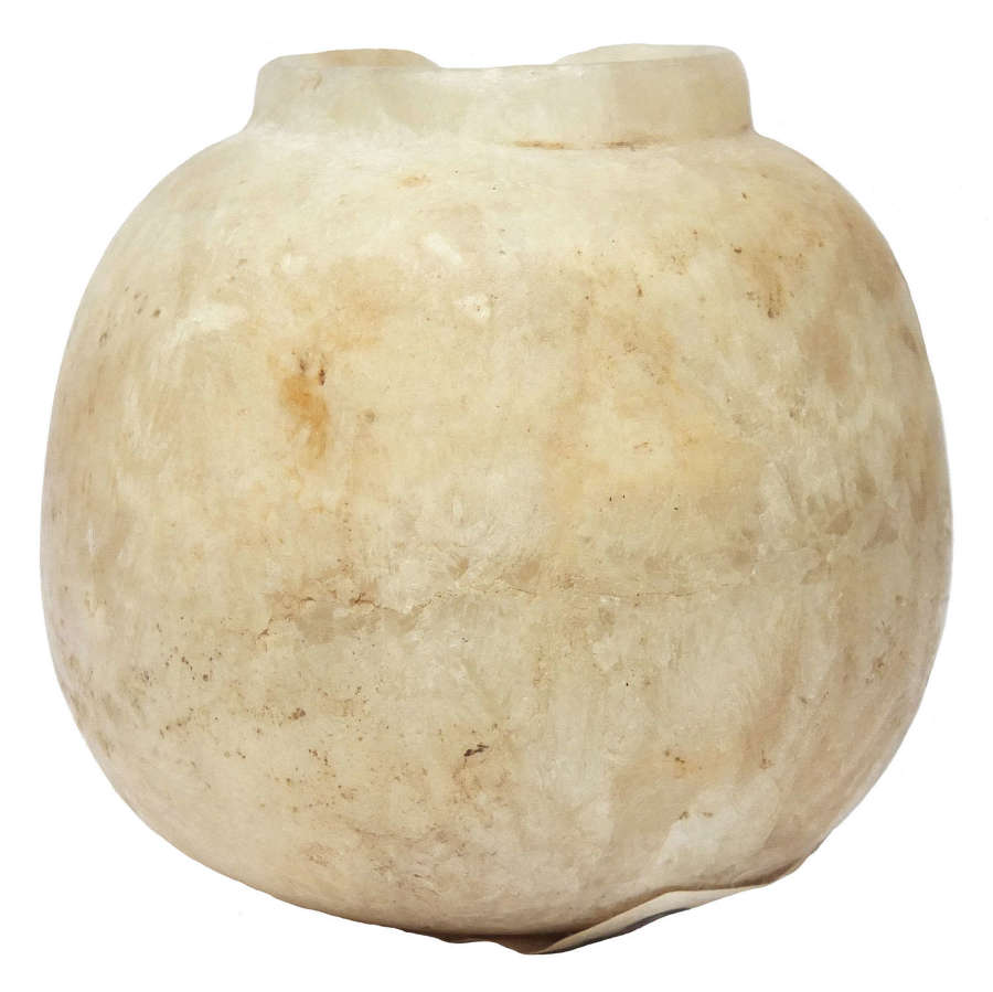 An Egyptian ovoid alabaster cosmetic vessel, c. 1st Millennium B.C.