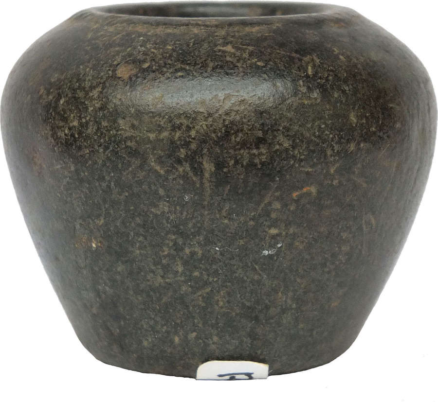 An Egyptian basalt kohl jar, Middle Kingdom, c. 2050-1650 B.C.
