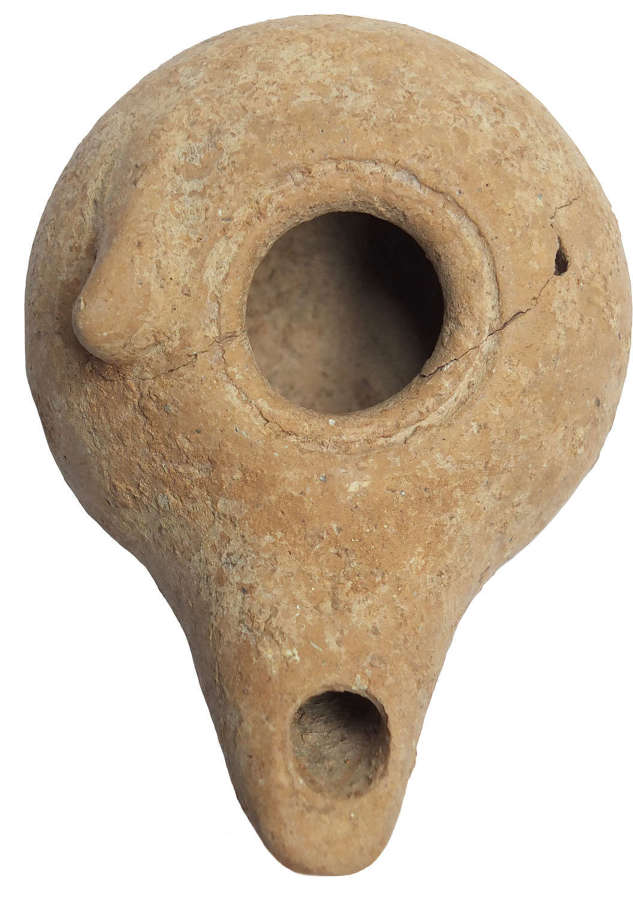 A Hellenistic pottery oil lamp, c. 3rd Century B.C.