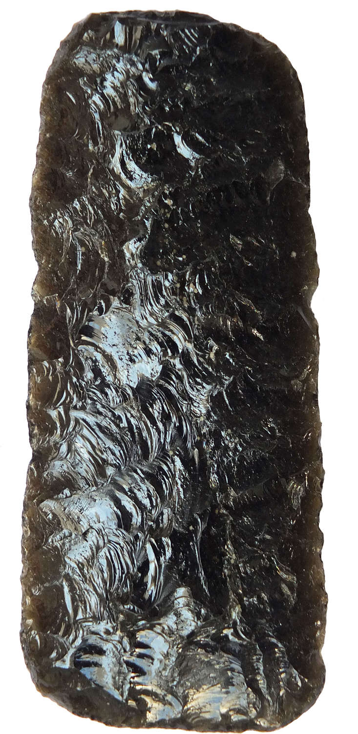 A Mexican sub-rectangular obsidian blade, ex Fawcett Collection