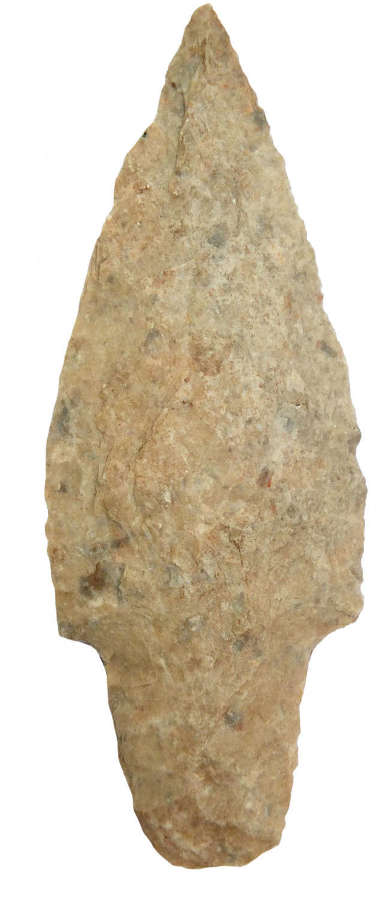 A good-sized triangular pale brown quartzite arrowhead