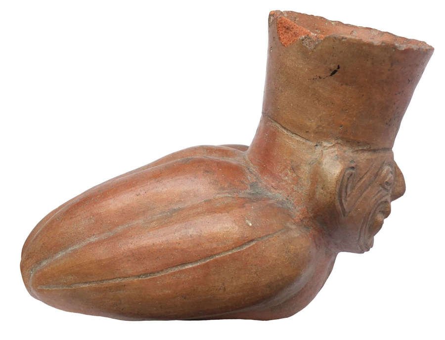 A Moche pottery vessel in the form of Ai Apaec as a manioc plant