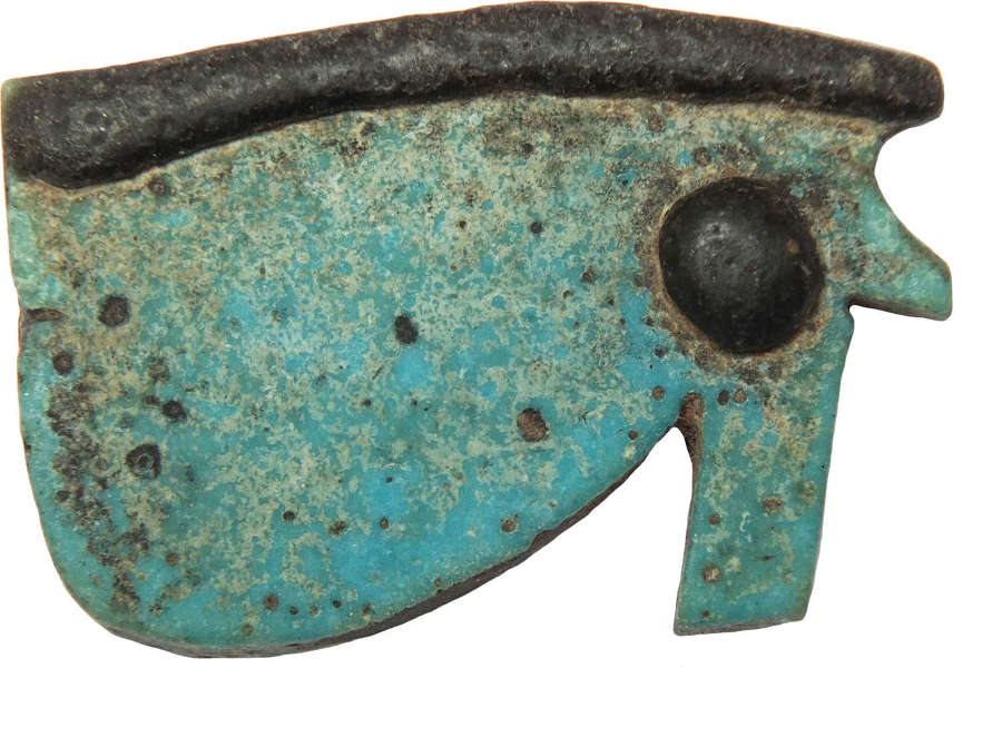 An Egyptian carolina blue Udjat Eye amulet, c. 600 B.C.
