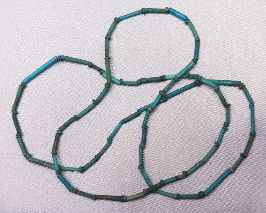 A group of Egyptian dark blue faience beads restrung as a necklace