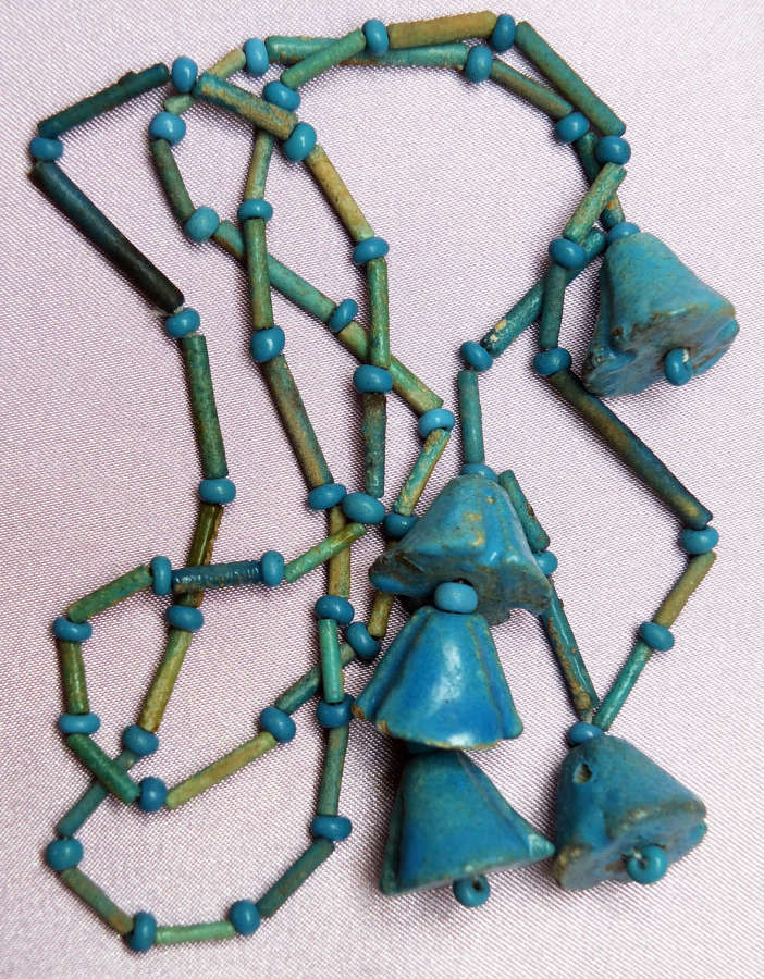 A group of Egyptian blue faience beads restrung as a necklace