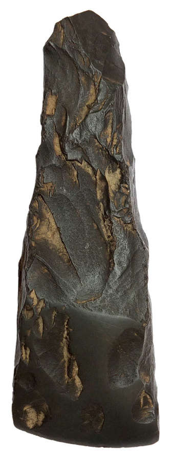 A dark gray argillite partially-polished axe- or adzehead